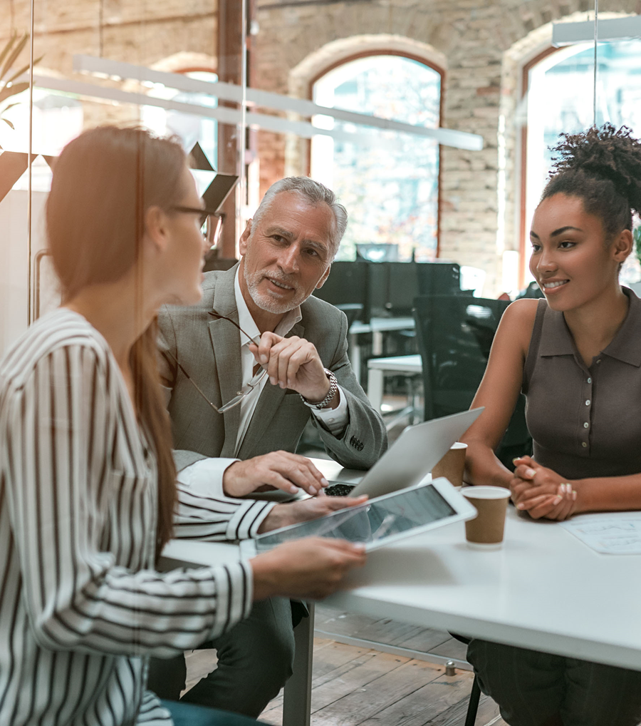 A group of business leaders discussing around a table