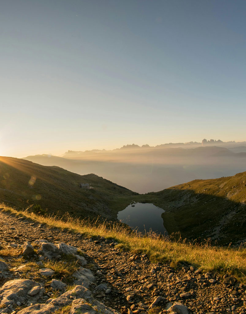 A photo of a sunset over a misty valley